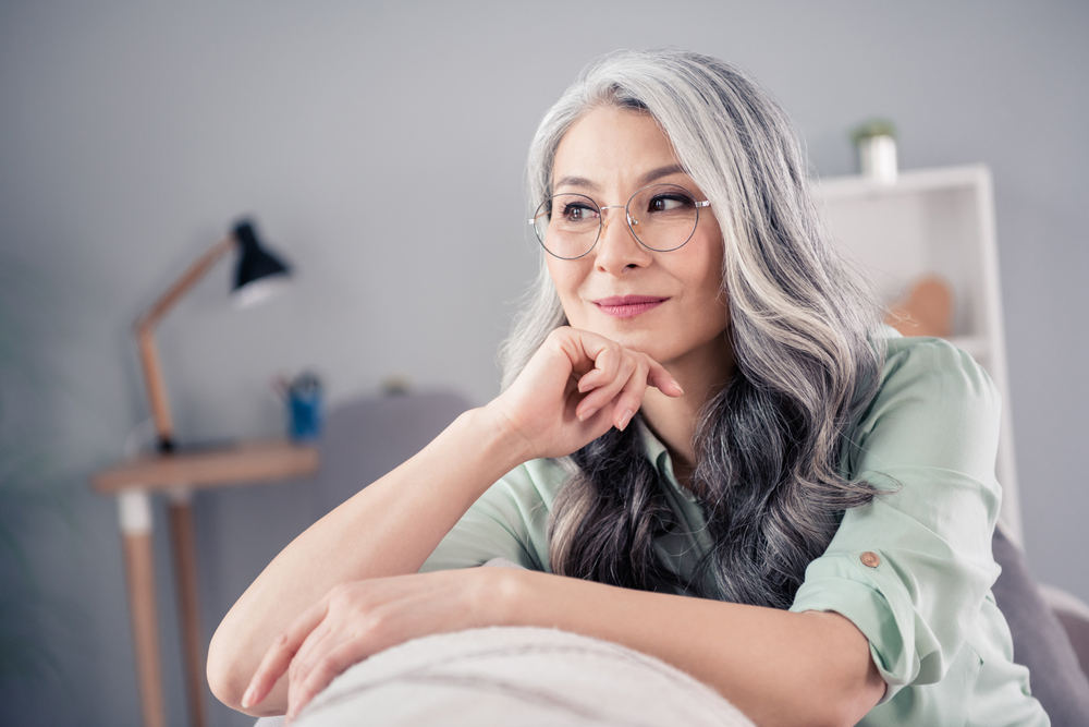 mature woman sitting on couch