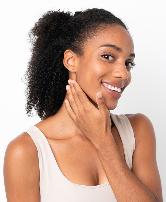 smiling woman touching her face